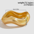 Gold bracelet with measurements and weight information on a light gray background