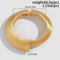Gold ring with measurements and weight details on a light gray background