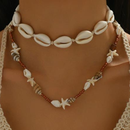 Necklace with shell and starfish beads on a mannequin