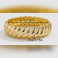 Gold ring with measurements on a white background